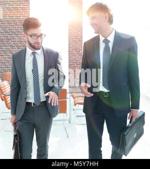 Two company employees discuss business issues Stock Photo