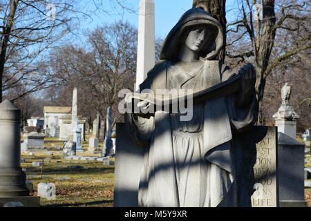 Close up of a figure in Rosehill Cemetery, Chicago's largest burial grounds. Stock Photo