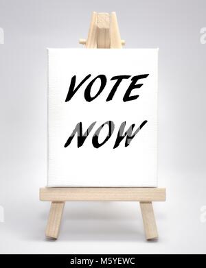 Vote now concept white canvas artist easel Stock Photo