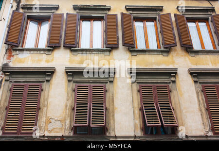 Old house with brown shutters in Florence, Italy (Firenze) Stock Photo