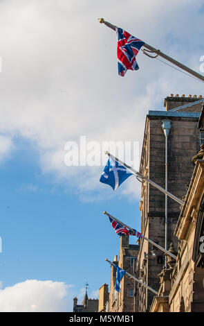 British Union Jack and Scottish Saltire on a top of City Chambers in Edinburgh, Scotland Stock Photo