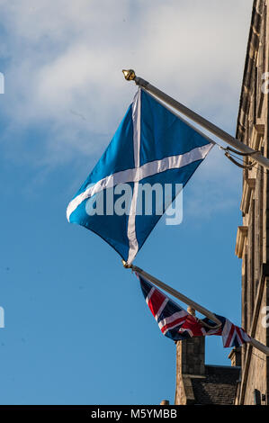 British Union Jack and Scottish Saltire on a top of City Chambers in Edinburgh, Scotland Stock Photo