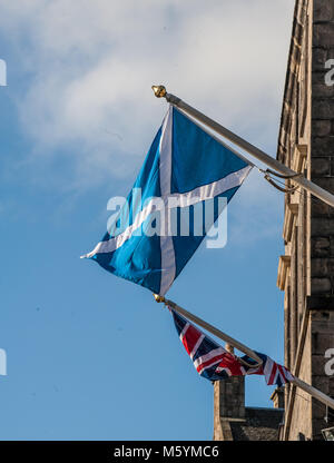 British Union Jack and Scottish Saltire on a top of City Chambers in Edinburgh, Scotland Stock Photo