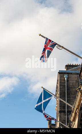 British Union Jack and Scottish Saltire on a top of City Chambers in Edinburgh, Scotland Stock Photo