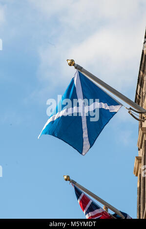 British Union Jack and Scottish Saltire on a top of City Chambers in Edinburgh, Scotland Stock Photo