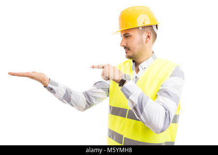 Engineer or architect holding presenting empty copy space on palm isolated on white background Stock Photo