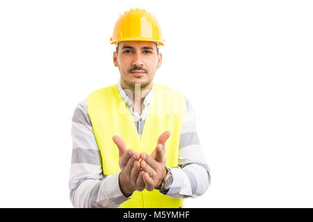 Engineer or construction worker asking demanding begging for answers gesture isolated on white background Stock Photo