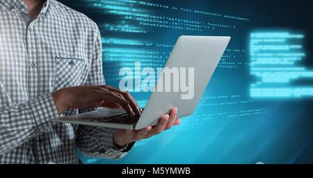 Man typing coding text on laptop Stock Photo