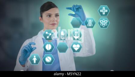Female doctor interacting with medical hexagon interface Stock Photo