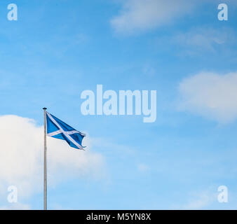 Scottish Saltire flag and blue sky with clouds Stock Photo