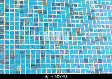Checkered tile background pattern. Architectural mosaic detail, abstract background for bath and pool. Blue, green and white tiles