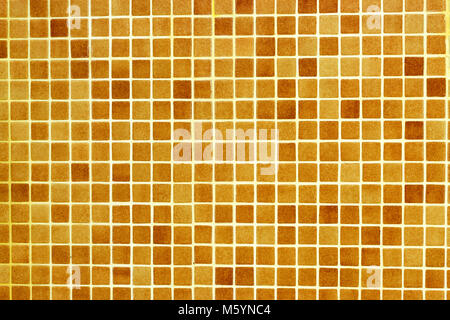 Checkered tile background pattern. Architectural mosaic detail, abstract background for bath and pool. Brown, orange, beige and ochre tiles Stock Photo