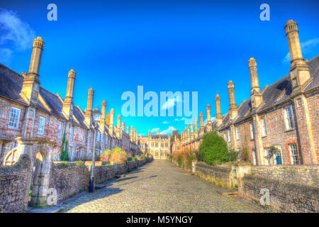Vicars Close next to Wells Cathedral Somerset England uk historic row of cottages, houses and chimneys in colourful hdr Stock Photo