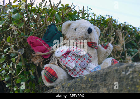 Lost teddy bear looking for owner in Crewkerne, Somerset, UK in late winter Stock Photo