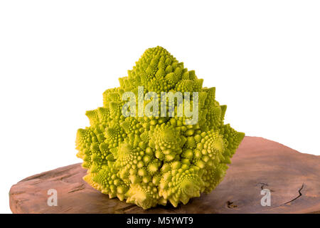 Cauliflower Romanesco on wooden board isolated on white background, clipping path included, closeup. Stock Photo
