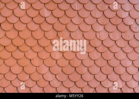 Red painted wood tiling roof wall texture background Stock Photo