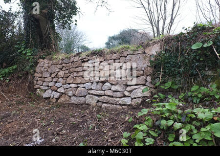 A newly built section of a Cornish granite wall. Stock Photo