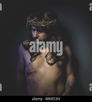 Jesus of Nazareth, representation of the Calvary of Jesus, son of God. He has the wound on his side and the crown of thorns Stock Photo