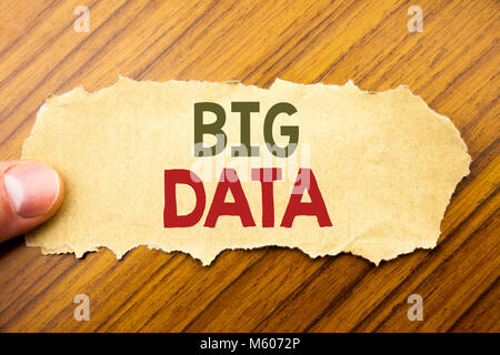 Writing text showing Big Data. Business concept for Digital Business Analysis written on note paper on wooden background with human finger. Vintage st Stock Photo