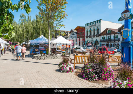 Summer Street Scene with Tourists and Art Fair in Bavarian Themed Tourist Village of  Leavenworth, Washington, in Cascade Mountains Stock Photo