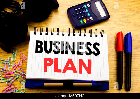 Conceptual hand writing text caption showing Business Plan. Business concept for Mission or Vision written on notebook book on the background in the O Stock Photo