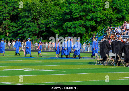 JUNE 17 Sayrevielle NJ USA: Graduates are walking the line to get a diploma and selective focus. Stock Photo