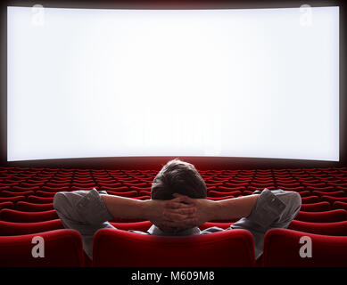 empty movie theater hall with lonely VIP man sitting Stock Photo