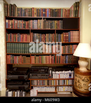 Home Library With Book Shelves Covering Walls Stock Photo