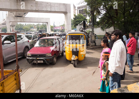 Car being towed by small truck using a rope in Hyderabad,India Stock ...