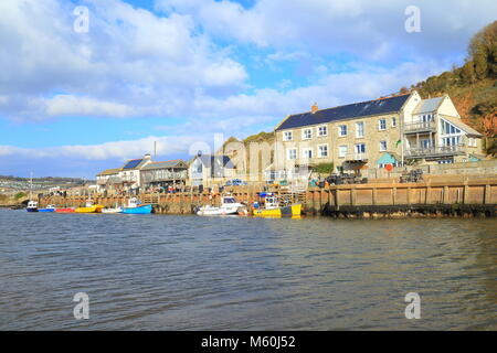 Colourful boats moored at Axmouth Harbour on the river Axe Estuary near town of Seaton in East Devon Stock Photo