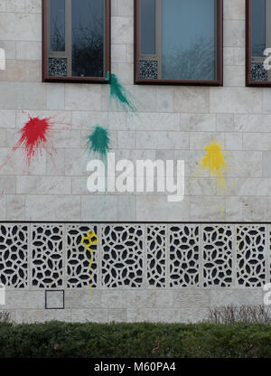 27 February 2018, Germany, Berlin. Colourful paint stains seen on the facade of the Turkish Embassy. So far unknown perpetrators attacked the building with paint bags in the early morning. The used colourd red, green and yellow might symbolise the Kurdish flag. Photo: Paul Zinken/dpa Stock Photo