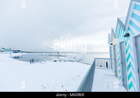 Southend-on-Sea, Essex. 27th Feb, 2018. UK Weather: Southend Pier from Three Shells beach over the Lagoon with beach huts. Thames River, Western Esplanade, Southend-On-Sea, Essex. Credit: graham whitby boot/Alamy Live News Stock Photo