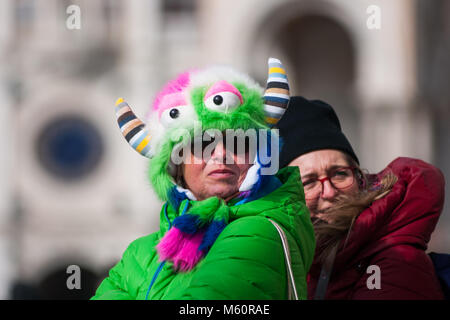 Venice, Italy. 27th February, 2018. A woman wearing a fur hat visits St. Mark square during the coldest days of the winter due to the arrival of the Burian in Venice, Italy. © Simone Padovani / Awakening / Alamy Live News Stock Photo