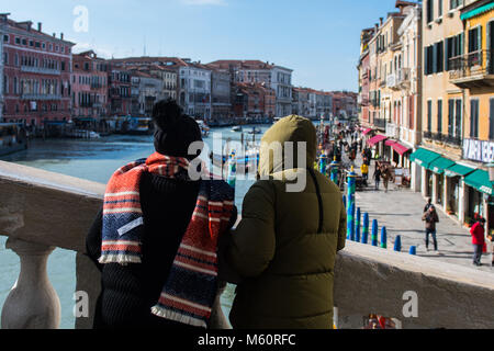 Venice, Italy. 27th February, 2018. Tourists wearing heavy clothes visit Rialto bridge during the coldest days of the winter due to the arrival of the Burian in Venice, Italy. © Simone Padovani / Awakening / Alamy Live News Stock Photo