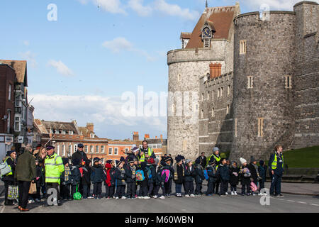 Windsor, UK. 27th February, 2018. Schoolchildren watch the Changing of the Guard ceremony at Windsor Castle. Credit: Mark Kerrison/Alamy Live News Stock Photo