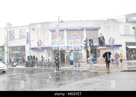 Tooting, London, UK. 27th February, 2018.  Shoppers fight through the snow in Tooting, South London, England, UK. Credit: London Snapper Credit: London Snapper/Alamy Live News Stock Photo