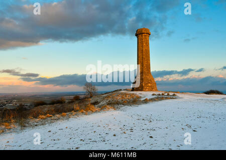 Hardy's Monument, Portesham, Dorset, UK.  27th February 2018.  UK Weather.  A light covering of snow at Hardy's Monument in Dorset after a series of wintery showers passes through at the end of the day.  Picture Credit: Graham Hunt/Alamy Live News Stock Photo