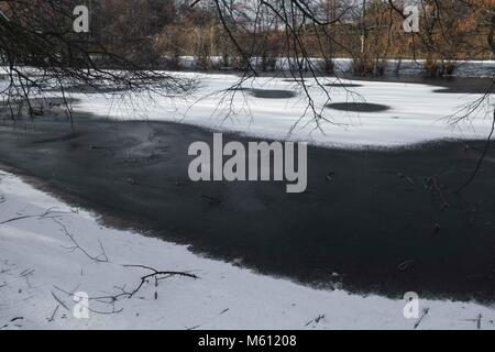 London 27th February 2018: Blackheath pond frozen over in South London  as tempartures are expected to dip this evening in parts of Scotland and northern England to  11C.  Credit : Claire Doherty/17�Թ����� Live News Stock Photo