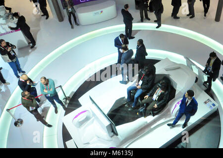 Barcelona, Spain. 27th Feb, 2018. Visitors seen trying out the virtual reality goggles at the Mobile World Congress.The Mobile World Congress 2018 is being hosted in Barcelona from 26 February to 1st March. Credit: Images from the second day of the 18th MWC in Barcelona  19 .jpg/SOPA Images/ZUMA Wire/Alamy Live News Stock Photo