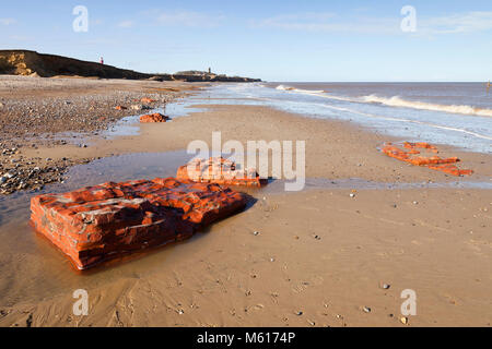 The remains of the Low Light Lighthouse on the beach at Happisburgh in Norfolk England UK Stock Photo