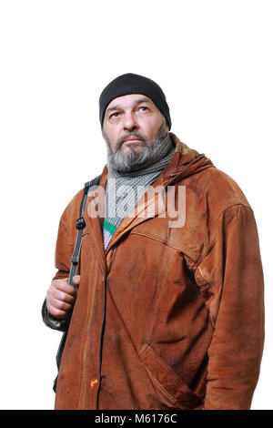 Real man with a beard in a hat and scarf in a brown leather jacket, with a bag on a white background Stock Photo