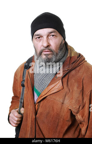 Real man with a beard in a hat and scarf in a brown leather jacket, with a bag on a white background Stock Photo