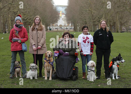 (left to right) Vanessa Holbrow, 47, from Burnham on Sea in Somerset, with her Border Terrier Sir Jack Spratticus; Hannah Gates, 19, from Hazlemere in Buckinghamshire, with her Shih Tzu Buttons; Clare Syvertsen, 29, from Notholt in London, with her Labrador/Golden Retriever cross Griffin; Sarah Mohammadi, 14, from Hayes in west London, with her Cocker Spaniel/Poodle cross Waffle, and Gayle Wilde, 39, from Kilsyth in Lanarkshire, with her Border Collie Taz, during a photocall by The Kennel Club in Green Park, London, to announce the finalists for the Crufts dog hero competition, Friends for Lif Stock Photo