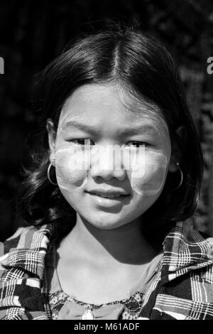 Bagan, Myanmar, December 27, 2017:  Portrait of a young girl with Tanaka paste on her face, Stock Photo