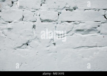 Loft old brick wall painted with white paint and stucco Stock Photo