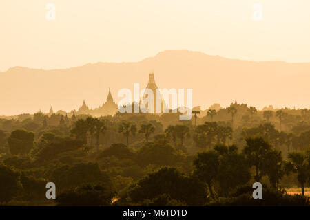 Landscape with temples and pagodas in the magic evening light in Bagan, Myanmar Stock Photo
