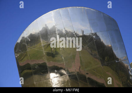 A reflection of Buenos Aires is seen in a petal of the giant aluminum and steel flower Floralis Generica sculpture by Eduardo Catalano. Stock Photo