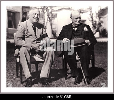 Vintage 1943 photograph of President Roosevelt and Prime Minister Winston Churchill. During World War II, President Roosevelt made a number of trips to meet with foreign leaders to discuss the war effort and the postwar world. At the end of 1943, FDR traveled to Cairo, Egypt and Teheran, Iran.  On November 25, 1943, Thanksgiving Day, FDR was in Cairo and met with Winston Churchill Stock Photo