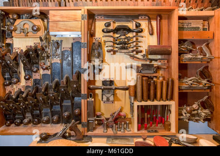 Collection of antique woodworking tools in a wooden chest.    Lots of texture and warmth with a vintage subject and look. Stock Photo