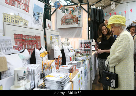 Britain's Queen Elizabeth II chats to stall holder Danielle Morgan as she tours St.Georges Market in Belfast, Tuesday June 24th, 2014. The Queen is on a 3 day tour of Northern Ireland.  Photo/Paul McErlane Stock Photo
